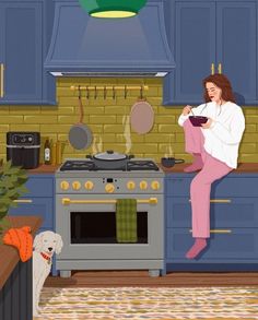 a woman sitting on top of a stove next to a dog