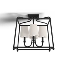 three light chandelier with white shades on the bottom and black metal frame around it