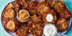 some fried food on a plate with dip and sauce