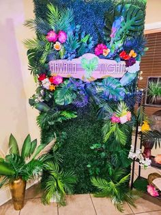 a display with flowers, plants and a sign that says havana nights on it's side