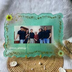 a group of people standing next to each other in front of a white fur rug