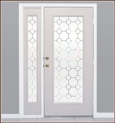 a white door with frosted glass on the top and side panels, in front of a gray wall