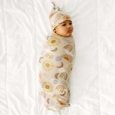 Child swaddled in a Desert Sunrise swaddle and hat set Newborn Swaddle Set, Desert Sunrise, Newborn Swaddle, Swaddle Sets, Ray Of Sunshine, Baby Swaddle Blankets, Matching Hat, Lemonade Stand, Hat Set