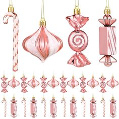 pink christmas ornaments and candy canes hanging from gold chains on a white background with clipping lines