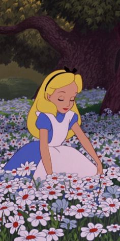 the princess sitting in a field of daisies with her eyes closed and hands behind her back