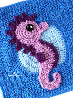 a crocheted square with a sea horse on it