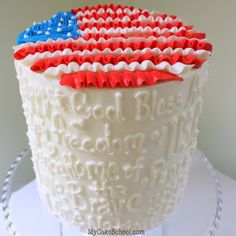 an american flag cake with red, white and blue icing on it's side