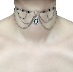 Evelyn Choker 🤍 This quirky, unique, regencycore inspired choker was made using silver chains in different mediums, acrylic beads, seed beads and also adorned with gorgeous rhinestone cameo charm finished with a silver lobster clasp and extension chain  🖤 Only one available as I like to make one of a kind pieces so that you have a unique, standout, rare, special piece that you can't find anywhere else. Keep your jewellery away from water, oils, perfumes and make sure to remove before showering and sleeping in order to keep it in it's best condition. Sphider Design Unique, Quirky, Regal, Fairycore, Princesscore, Regency, Victorian, Edwardian, Handmade Victorian Metal Choker Necklace, Victorian Style Metal Choker Necklace, Gothic Silver Chain Choker Jewelry, Vintage Silver Jeweled Choker, Gothic Silver Choker Necklace, Vintage Silver Choker With Jewels, Victorian Metal Choker Jewelry, Silver Vintage Beaded Choker, Silver Gothic Cameo Jewelry