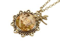 This cute necklace is a lovely gift idea for cat fans. The pendant consists of a flower-shaped setting and a hand-crafted glass cabochon that shows a motif with three kittens. There is also a dragonfly charm above the pendant. The pendant measures 3.6 L x 3.2 W cm. The chain is 45 cm long and can be extended to 50 cm. Metal Jewelry With Cat Design, Metal Cat Design Round Jewelry, Cute Cat Design Round Jewelry, Cute Cat Design Jewelry, Cute Round Cat Design Jewelry, Cute Nickel-free Round Necklaces, Gift Cabochon Metal Necklace, Metal Jewelry With Cat Design For Gift, Cat Design Metal Jewelry As Gift