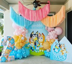 a birthday party with balloons and decorations