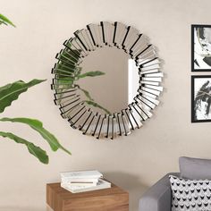 a mirror hanging on the wall next to a couch