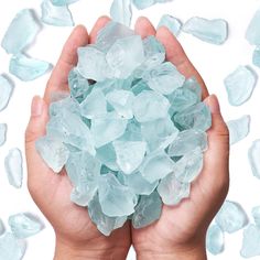 a person holding some ice crystals in their hands