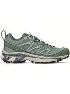 the north face women's hedgehog trail running shoe is shown in green and grey