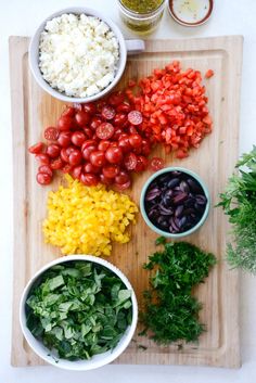 the ingredients for this salad are laid out on a cutting board and ready to be put into bowls