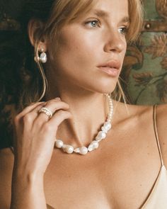 Redefine expectations with our feminine Genova pearl earrings. Combining classic with a touch of something more unique - this bold duo is what we call a modern heirloom. Hair up or down - the Genova earrings will perfectly accentuate your every look. 

Break the mould & pair with the Champagne Necklace to prove once again that beauty is so much more than perfection. 
Details

Handcrafted in a thick layer of 18k gold on sterling silver2 genuine 11-13 mm freshwater baroque drop pearls & 4 mm keshi Classic Teardrop Pearl Earrings For Everyday Elegance, Classic Teardrop Pearl Earrings For Everyday, Everyday Classic Teardrop Pearl Earrings, Everyday Elegance Teardrop Pearl Drop Jewelry, Teardrop Pearl Drop Jewelry For Everyday Elegance, Refined White Jewelry For Everyday Elegance, Modern Pearl White Jewelry With Pearl Drop, Elegant Pearl Necklace With Briolette Shape, Elegant Briolette Pearl Necklace