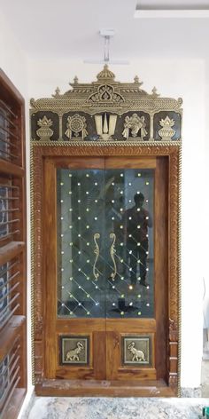 an ornate wooden door with glass inserts