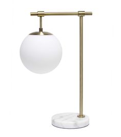 an image of a white ball on a brass stand with a marble base and round light bulb