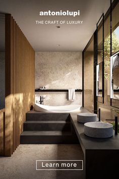 a bathroom with stairs leading up to the bathtub and sink, along with plates on the counter