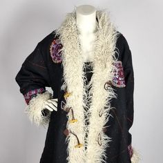 This kimono kaftan coat is completely handmade in India by Rabari tribal people, using the same technique as for their exclusive shawls/body wraps. The Rabari people live in the area of Kutch and Gujarat in India. They are a nomadic tribe; herding cattle, sheep and goats are their main source of income and is done by men. Rabari women are making the famous hand-woven shawls, amazing jewelry and stylish clothing. Each Rabari shawl (and therefore also coat) has a story: every design, each color, p Winter Festival Shawl Outerwear, Traditional Winter Costume Outerwear, Traditional Black Outerwear For Costume, Traditional Black Costume Outerwear, Bohemian Winter Costume Outerwear, Traditional Fall Costume Outerwear, Handmade Artisan Winter Outerwear, Folk Style Long Outerwear For Winter, Folk Style Long Winter Outerwear