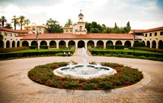 a fountain in the middle of a courtyard