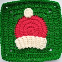 a crocheted square with a santa hat on it