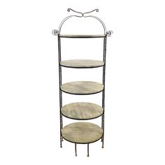 three tiered metal and wood shelf with circular shelves on each side, against a white background