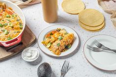 an enchilada and tortilla dish on a table