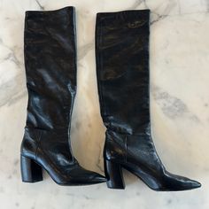 Black Leather Prada Boots In Size 37.5. Knee High But Can Be Worn Slouchy. Classic Formal Boots With Textured Leather, Classic Textured Leather Boots For Formal Occasions, Classic Textured Leather Formal Boots, Formal Textured Leather Boots, Black Heeled Boots With Leather Lining For Evening, Formal Black Heeled Boots With Leather Lining, Sleek Black Heeled Boots With Leather Lining, Designer Black Heeled Boots With Leather Lining, Prada Boots