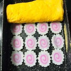 the dough is ready to be baked in the oven with pink and white circles on it