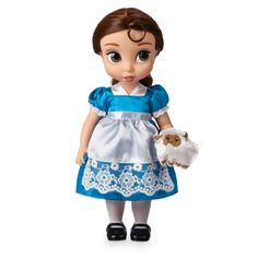 the doll is wearing a blue dress and holding a stuffed animal in her hand,