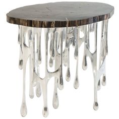 an artisticly designed table with dripping paint on it