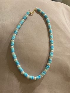 The clay beads can be more of a preppy style but this can also go along with a more blue and beachy aesthetic without the preppy. It's beachy and pretty and goes well with neutral colors (or really anything you want). Turquoise Round Beads Pearl Necklace For Beach, Blue Single Strand Beaded Necklace For Summer, Turquoise Pearl Necklace With Round Beads For Beach, Blue Shell Necklace For Summer In Beachy Style, Blue Beachy Shell Necklace For Summer, Blue Shell Strand Necklace For Summer, Beachy Blue Shell Necklace For Summer, Blue Beaded Shell Strand Necklace, Beachy Blue Jewelry With Colorful Beads