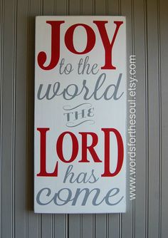 a sign that says, joy to the world the lord has come on wood planks