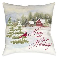 a watercolor christmas pillow with a cardinal on it