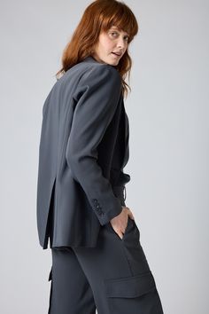 Upgrade your status with this classic blazer. It will work with denim and a tee if you're wanting a bold casual vibe, or pair with your favorite smart pants or skirt for an all over formal look. Regular Sleeve Standard Lapel Pockets Regular Length Buttons Up Gray Notch Lapel Blazer With Welt Pockets, Gray Semi-formal Blazer With Hidden Button Closure, Classic Blazer, White Blouse, Formal Looks, Moto Jacket, Charcoal Color, Fashion Help, Classic White