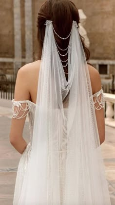 the back of a woman wearing a wedding veil