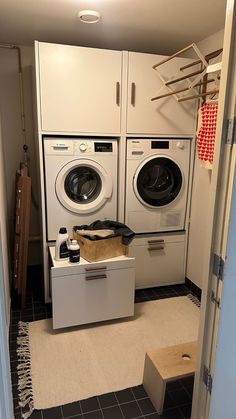 a washer and dryer in a small room