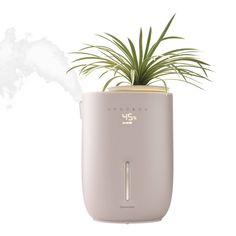 Dry indoor air can lead to static electricity, thirsty houseplants, and even dry skin—making breathing and sleeping conditions uncomfortable. The Homedics Natura Ultrasonic Warm & Cool Mist Humidifier combats dryness with a nozzle that converts water into a fine warm or cool mist, evenly releasing the perfect amount of moisture for spaces up to 402 sq. ft.* This sleek, modern humidifier, consciously crafted with recycled materials, not only enhances your decor but also includes a programmable di Modern Humidifier, Plant Humidifier, Humidifier For Plants, Waterless Diffuser, Paraffin Bath, Baby Sound Machine, Percussion Massager, Mist Humidifier, How Do You Clean