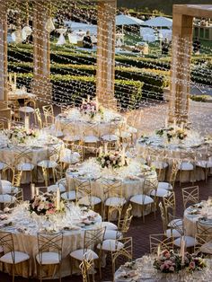 an outdoor wedding venue with tables and chairs