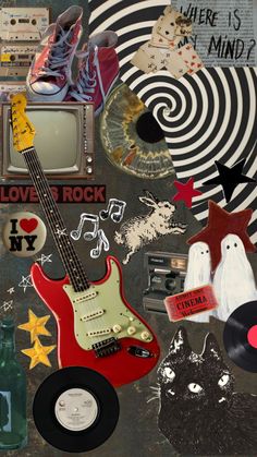 an assortment of stickers and magnets on a table with a guitar, record player, starburst