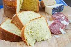 several different types of bread on a cutting board