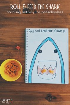 a book with the title roll & feed the shark counting activity for pre - schoolers