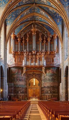 the inside of an old church with pews