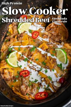 the slow cooker shredded beef enchilada is ready to be eaten