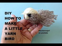 someone is holding a tiny toy bird in their hand with the words diy how to make a little yarn bird