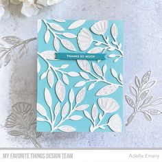 a blue card with white leaves and the words, my favorite things design team on it