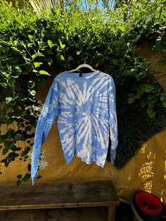 Embrace the perfect blend of comfort and style with this Handmade Blue & White Tie-Dye Cotton Shirt! Crafted on a high-quality, size Large Gildan tee, this shirt is made from 100% soft cotton, ensuring a comfortable fit for any occasion. Key Features: Vibrant Blue & White Tie-Dye: Each shirt is hand-dyed, making every piece truly one-of-a-kind. The eye-catching pattern is perfect for standing out at festivals, beach days, or casual outings. Size Large (Gildan): This unisex tee fits true to size and is made by Gildan, known for its durable and soft cotton fabric. Versatile & Stylish: Whether you're looking to add a boho vibe to your wardrobe or searching for the perfect gift, this tie-dye shirt is a great choice. Care Instructions: To maintain the vibrant colors, wash in cold water and air Blue Relaxed Fit Comfortable T-shirt, Spring Tie Dye T-shirt For Loungewear, Sporty Tie-dye Cotton T-shirt, Relaxed Fit Acid Wash Cotton Tops, Sporty Acid Wash Cotton Top, Summer Long Sleeve Loungewear T-shirt, Sporty Relaxed Fit Tie Dye Tops, Comfortable Acid Wash Top For Loungewear, Sporty Acid Wash Tops For Loungewear