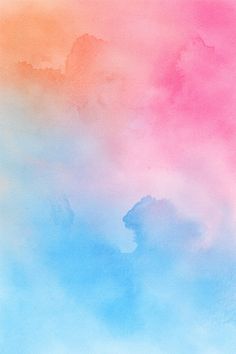 an abstract watercolor background with blue, pink and orange colors in the sky or clouds