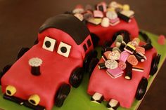 two cakes made to look like cars with hearts on them