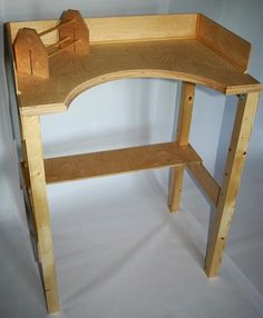 a wooden desk with two shelves on each side